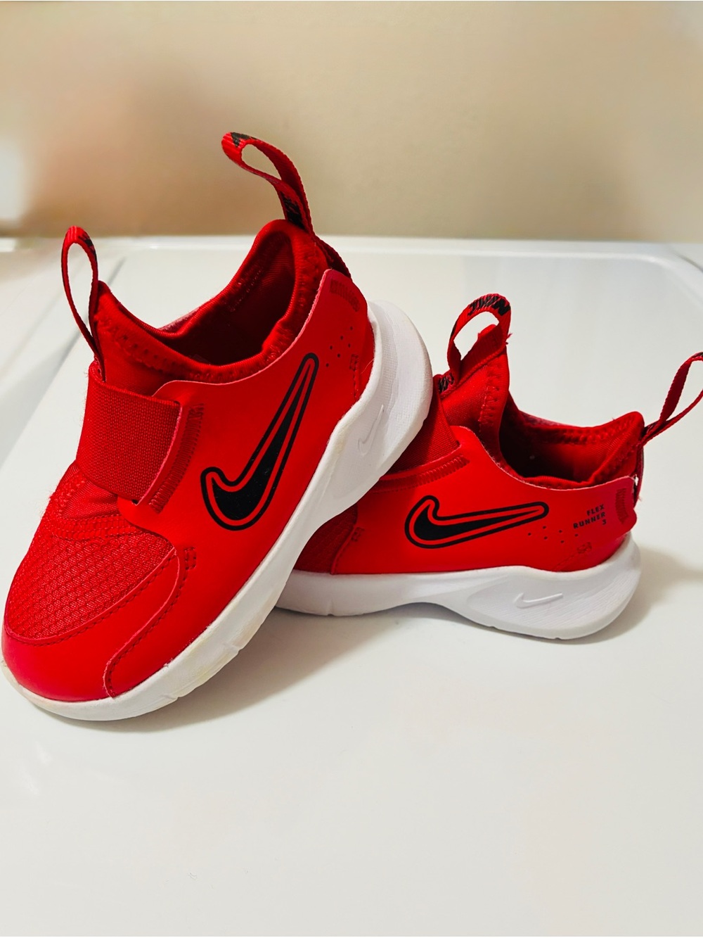 Nike Kids Red Slip-On Sneakers with Black Swoosh